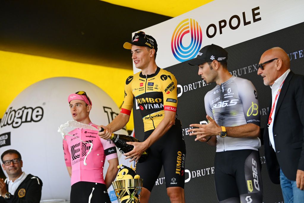 OPOLE POLAND AUGUST 01 LR Marijn Van Den Berg of The Netherlands and Team EF EducationEasyPost on second place race winner Olav Kooij of The Netherlands and Team JumboVisma and Matteo Moschetti of Italy and Q365 Pro Cycling Team on third place pose on the podium ceremony after the 80th Tour de Pologne 2023 Stage 4 a 1991km stage from Strzelin to Opole UCIWT on August 01 2023 in Opole Poland Photo by Dario BelingheriGetty Images