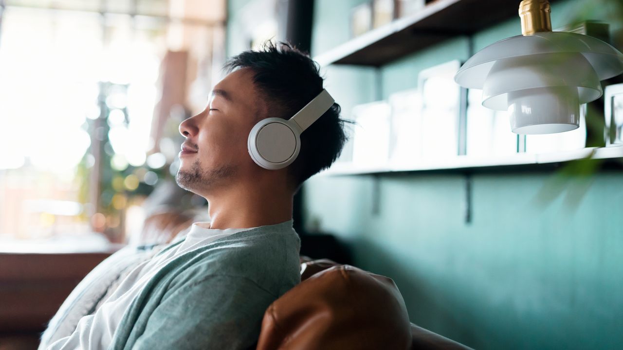 Man meditating at home