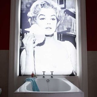 arty bathroom with printed blind