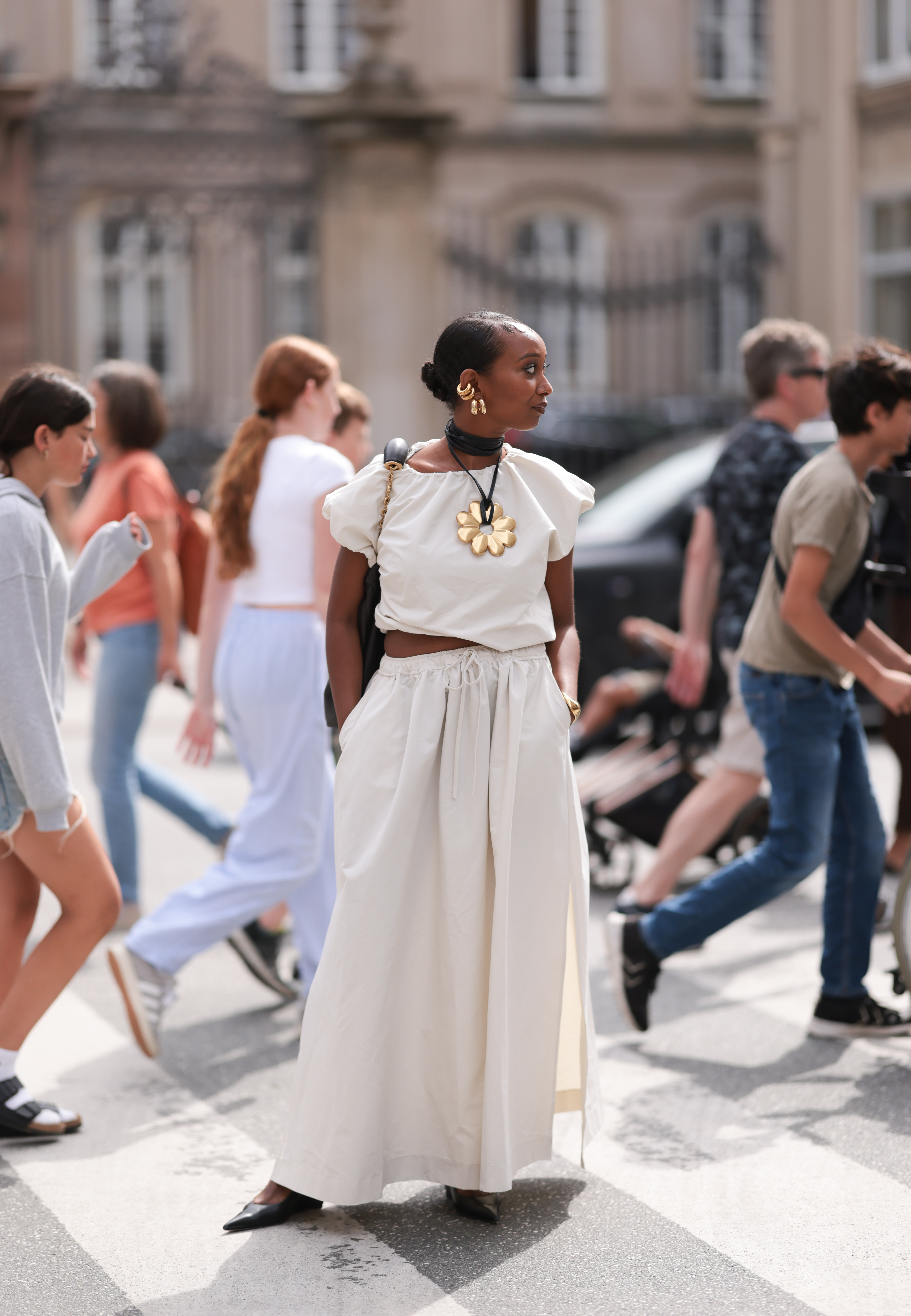 By Marlene Birger street style cream skirt and T-shirt with gold floral necklace