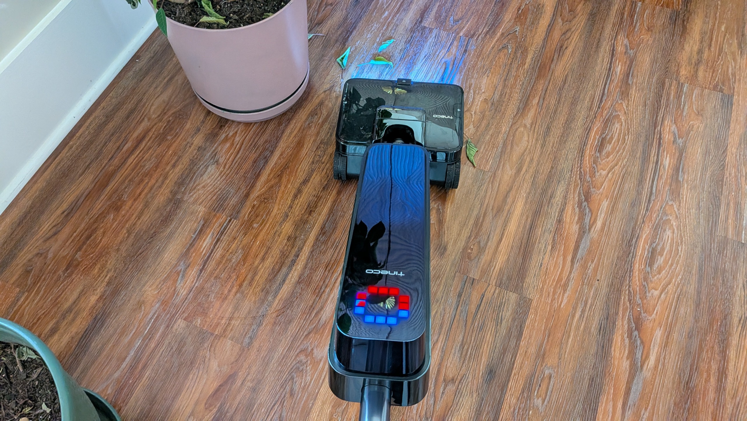 Tineco Floor ONE Station S9 Scientist Pro wet and dry vacuum cleaner vacuuming up leaves