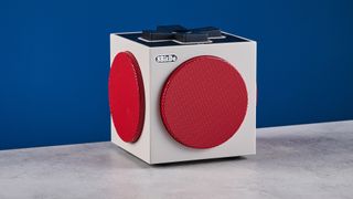 A beige, red and black 8BitDo Retro Cube 2 Bluetooth speaker