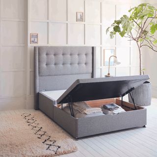 Grey ottoman bed open in bedroom