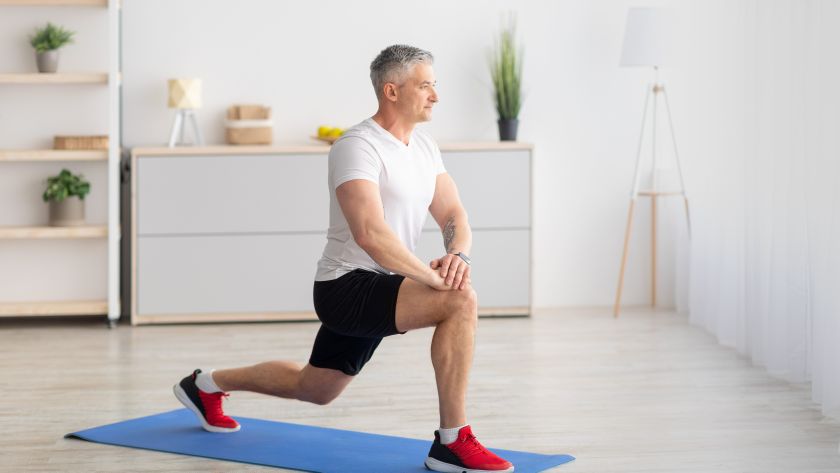 Man performing a lunge at home