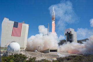 Delta 4 Heavy Rocket Launches NROL-65 Mission with Flag in Background
