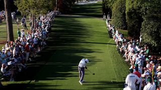 Scottie Scheffler takes a tee shot on the 18th at Augusta National