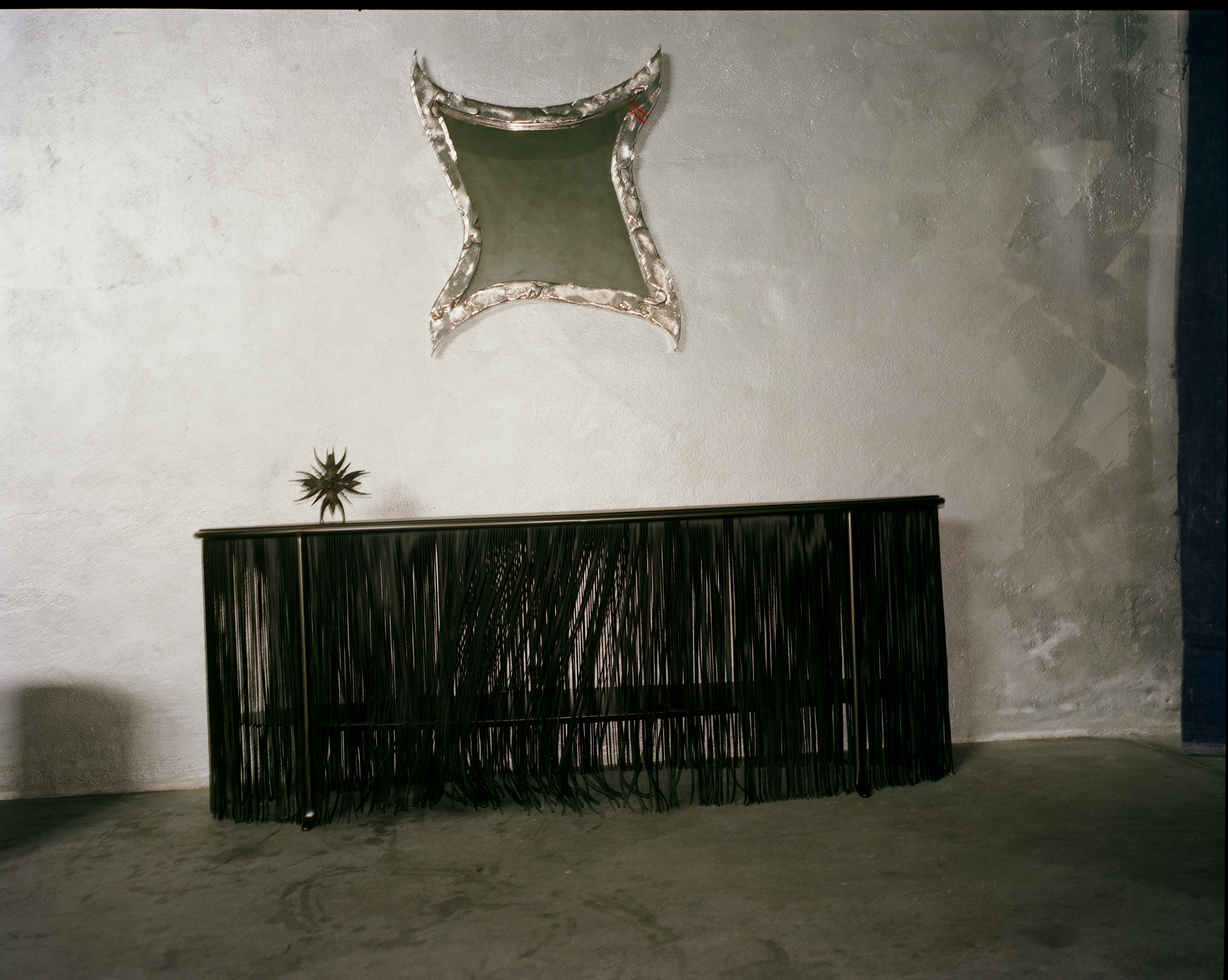 Dozie Kanu tables for Knoll with leather fringes