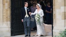 Duke and Duchess of Edinburgh standing in doorway to church after getting married