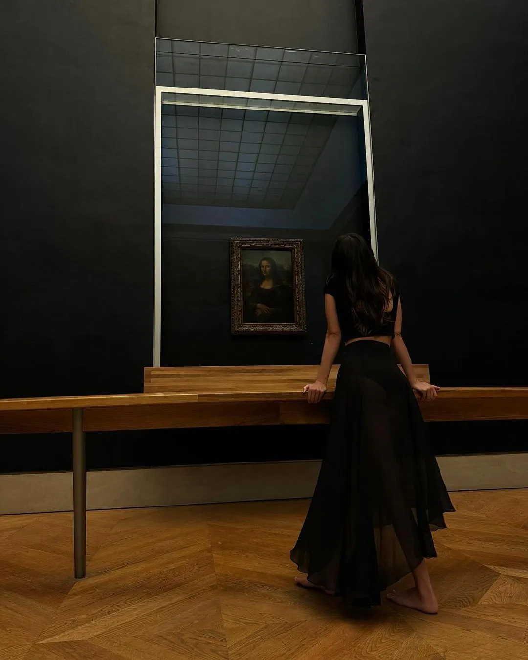Kendall Jenner stands in front of the Mona Lisa wearing The Row