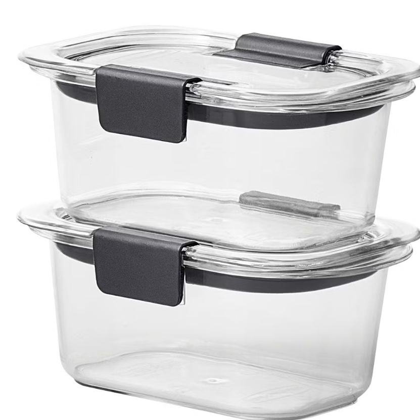 a stock photo of two clear glass storage containers stacked on top of each other with black closure clasps