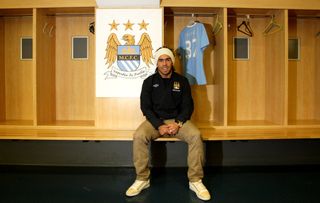 Barclays Premier League, Manchester City Press Conference, Carlos Tevez Signing, Manchester City's new signing Carlos Tevez poses in the dressing room