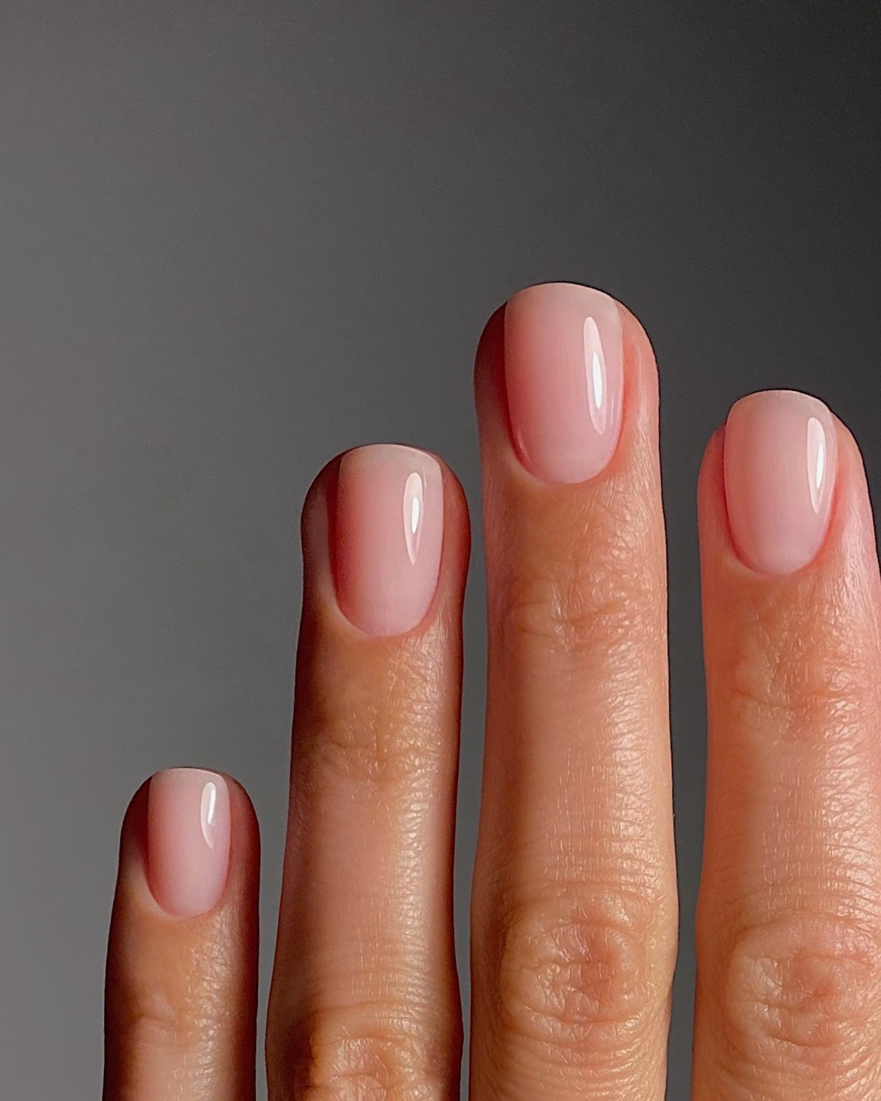Sheer pink milky nails.