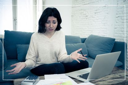 Women stressed with laptop wondering how to consolidate her debts