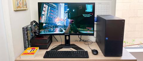Dell XPS 8960 review unit on a desk, Cyberpunk 2077 running onscreen