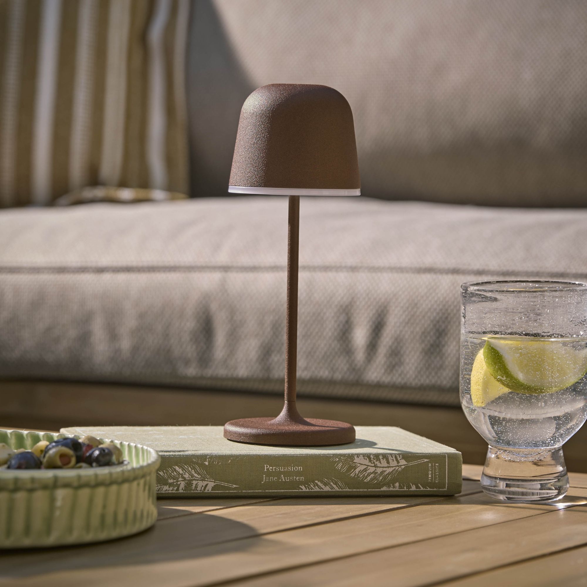 small brown lamp on top of book