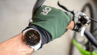 Garmin Forerunner 165 on wrist looking at post workout stats