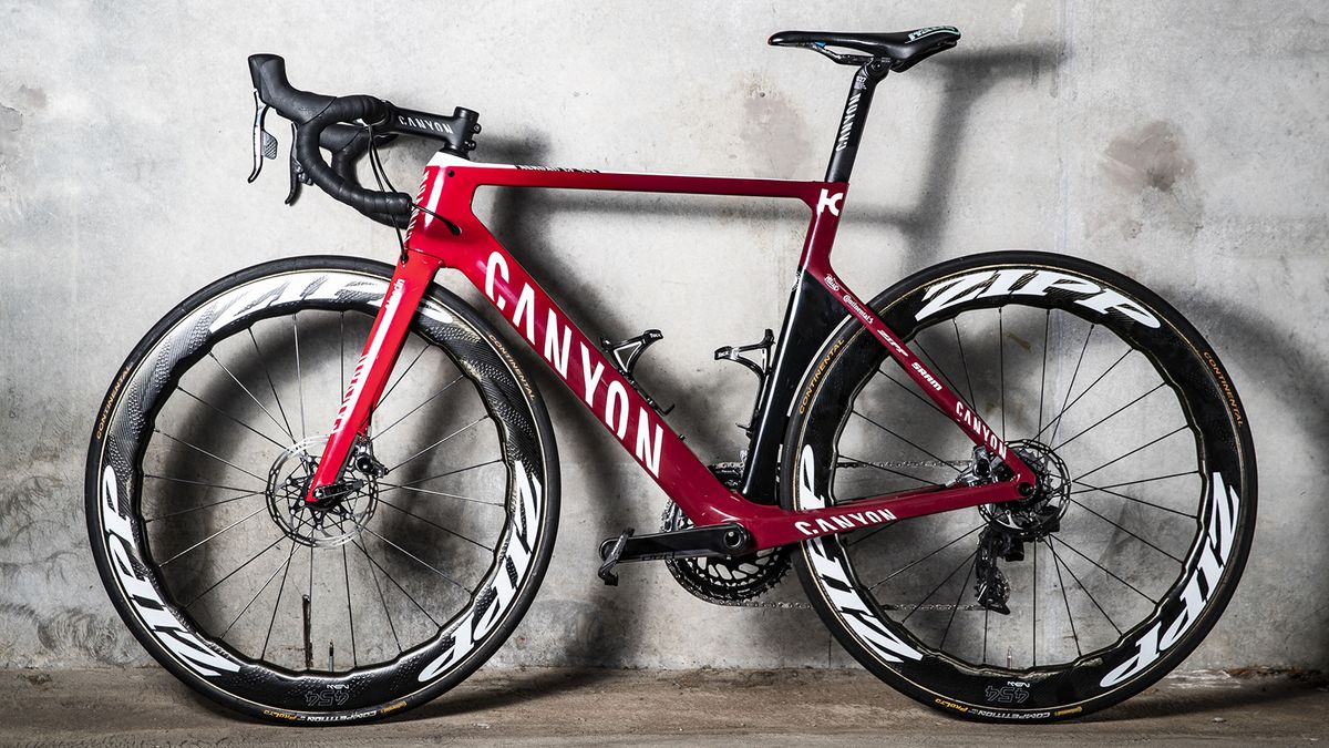 The Katusha-Alpecin Canyons feature a red fade paint design with black accents