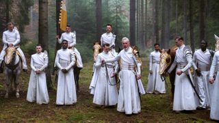 The Whitecloaks march through a forest in The Wheel of Time on Amazon Prime
