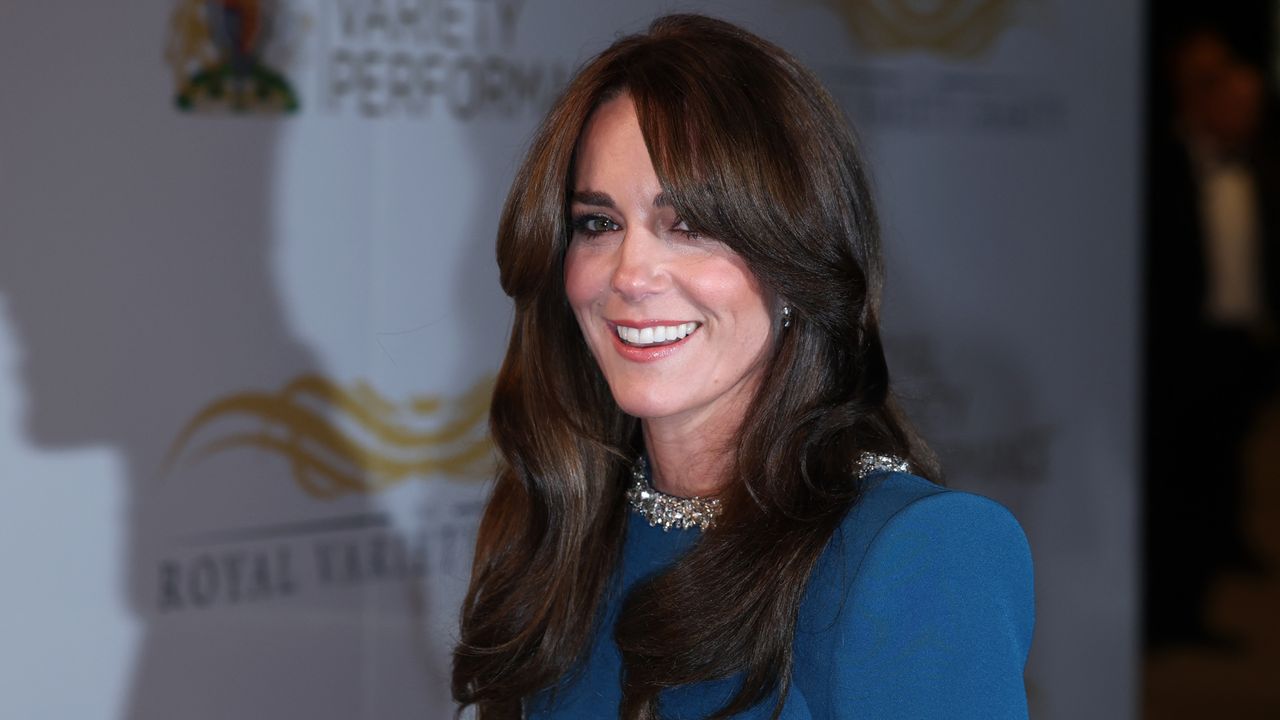 Kate Middleton&#039;s gorgeous teal gown with cape sleeves made a stunning statement as royals attended the Royal Variety Show 