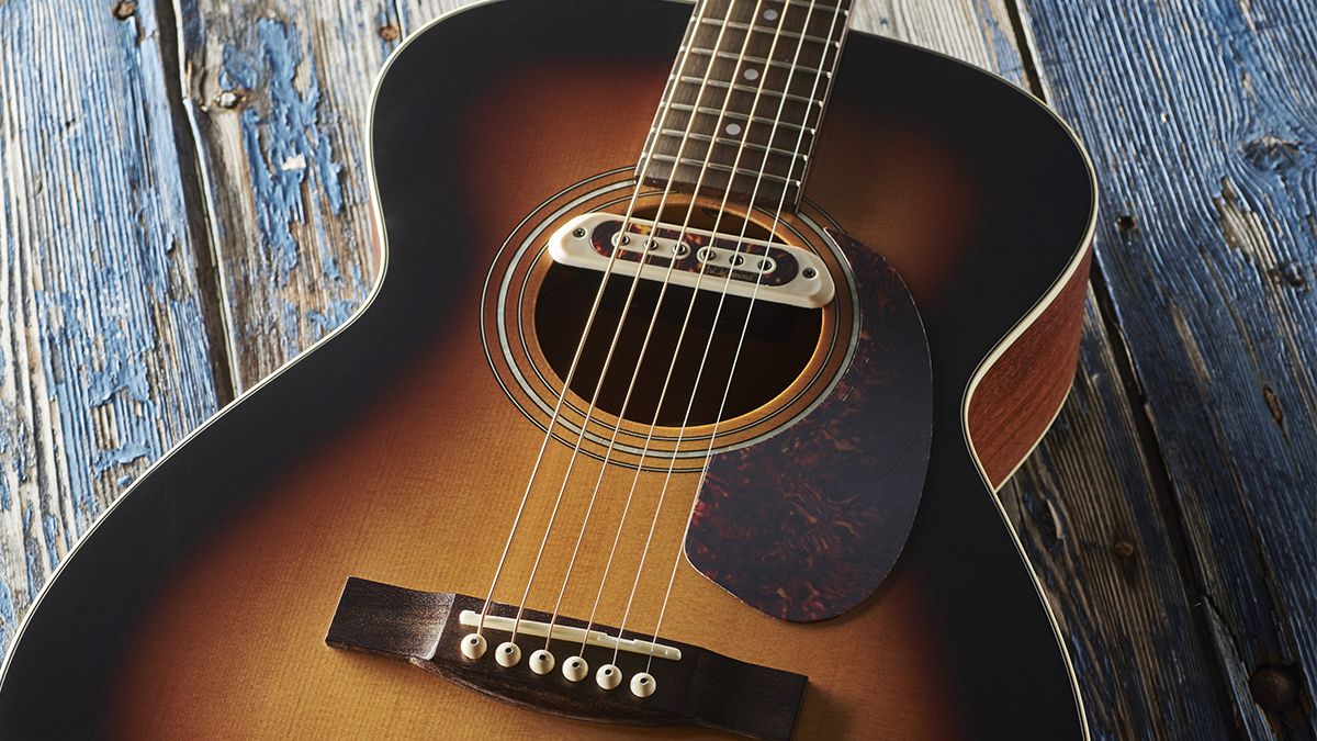 Description : A Guild M-240E Troubadour acoustic guitar fitted with a Tone Boss sound hole pickup, taken on August 30, 2017. 