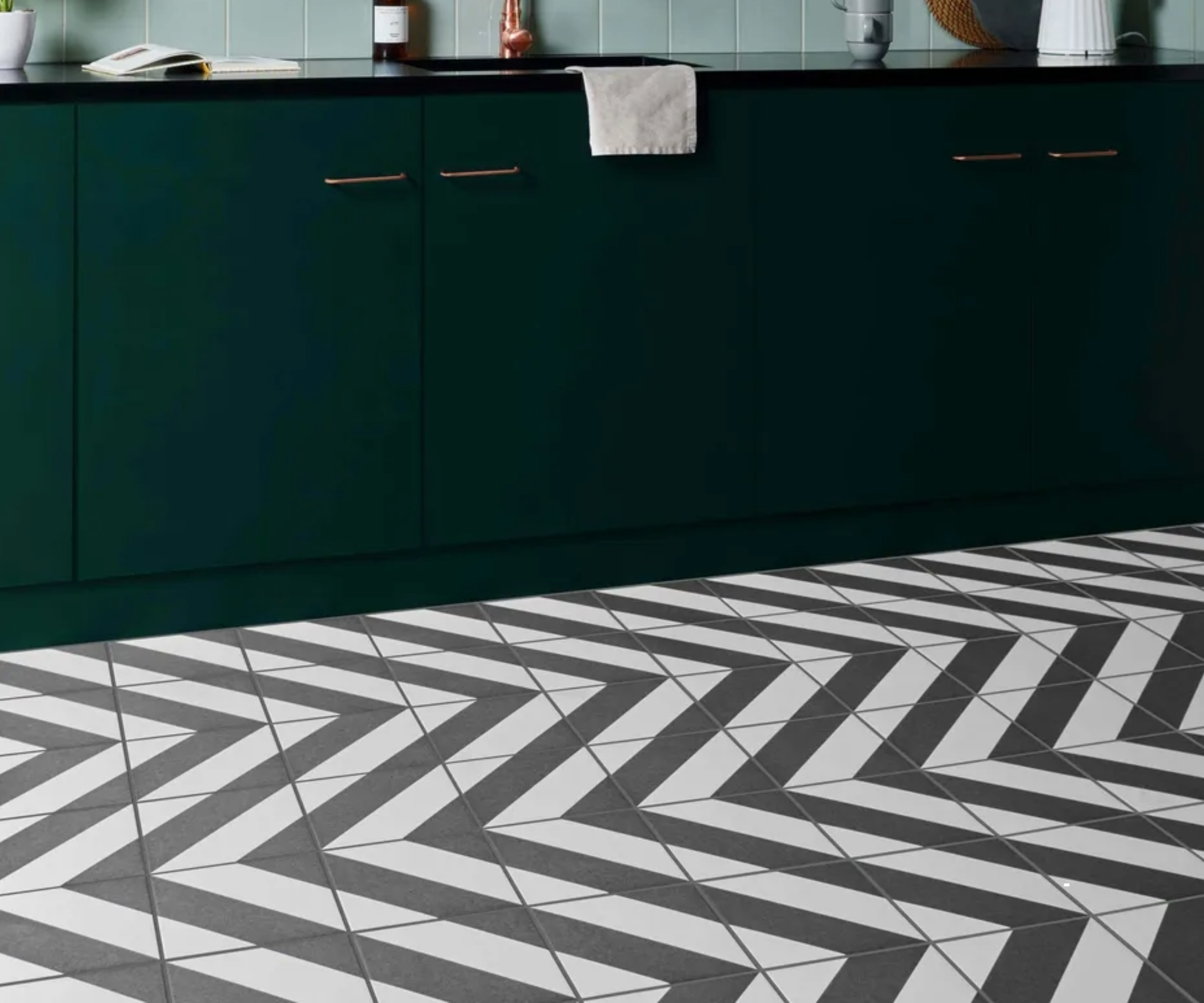 modern green kitchen with black and white zigzag floor tiles