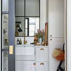 utility room with cabinet and washbasin