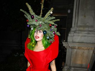 Lady Gaga customs a hat out of Christmas tree ferns