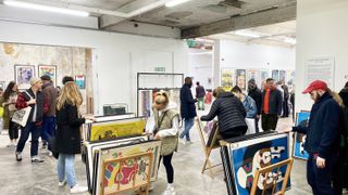 People shopping at a vintage poster market
