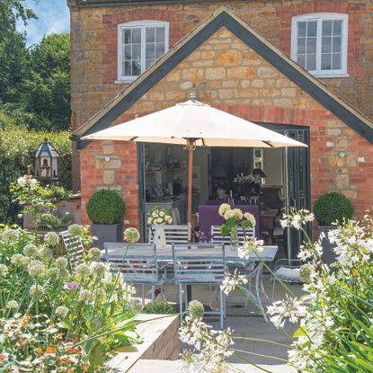 Garden with parasol over garden table