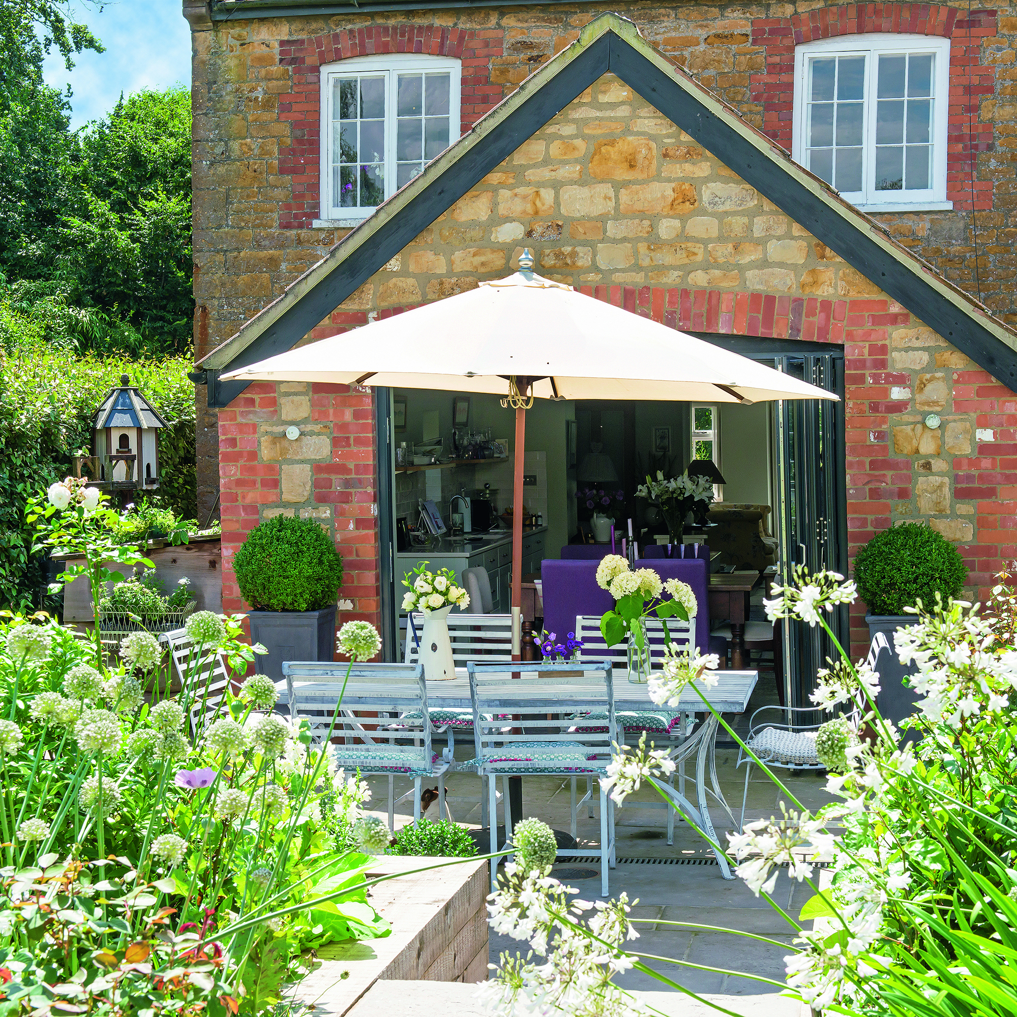 Garden with parasol over garden table