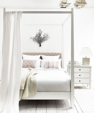 bedroom with white coloured and white curtain