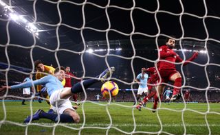 Manchester City defender John Stones clears the ball off the line in a vital win over title rivals Liverpool
