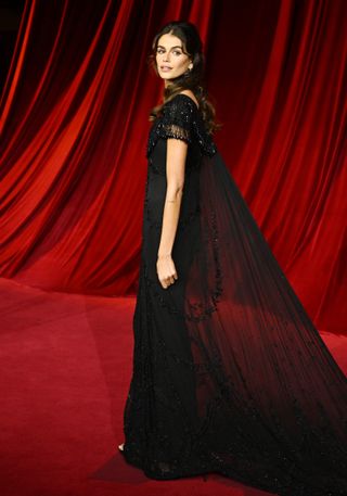 Kaia Gerber on the academy museum gala red carpet wearing a vintage givenchy gown