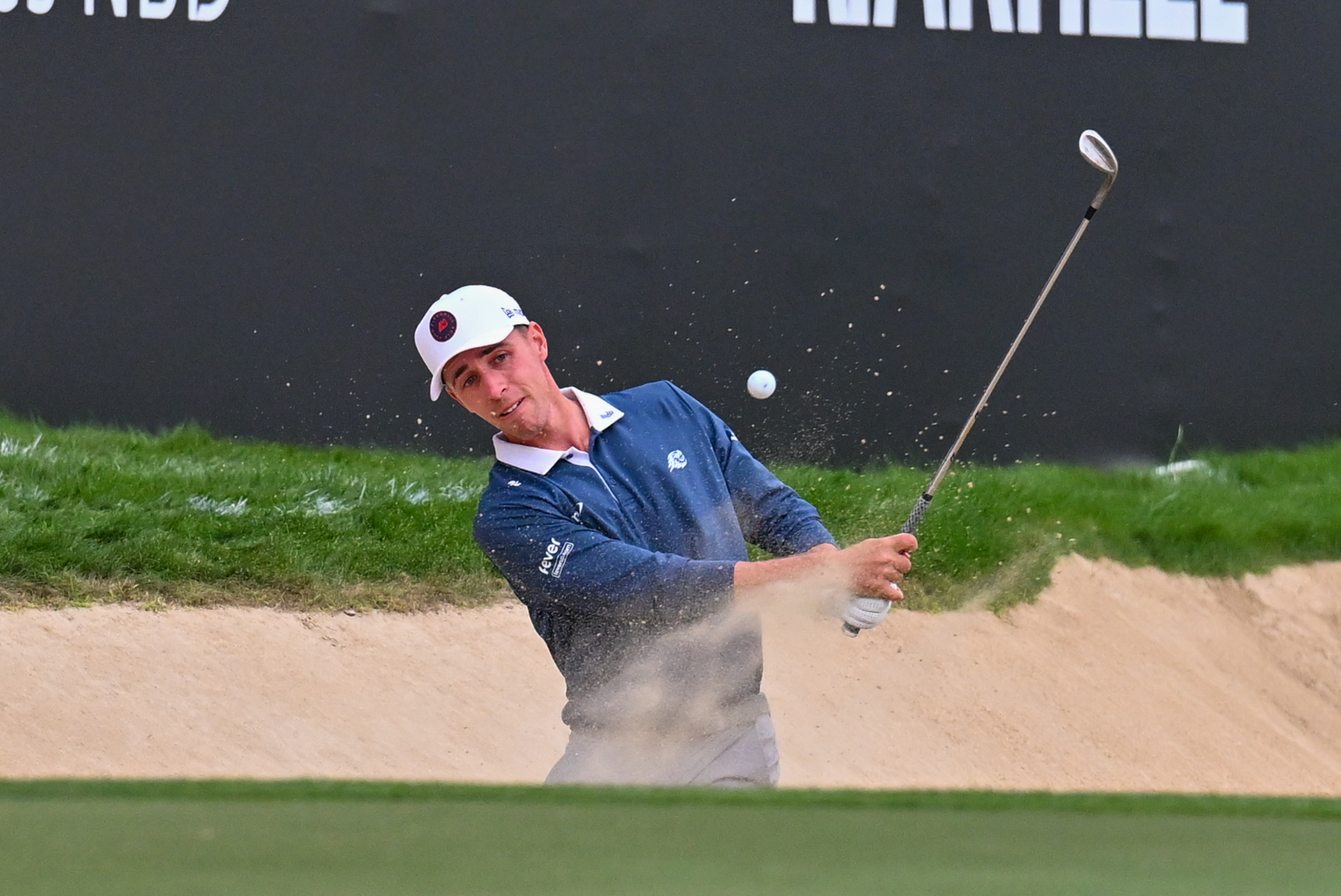 David Puig hits out of a bunker on the 18th hole during the final round of the 2026 Dubai Desert Classic