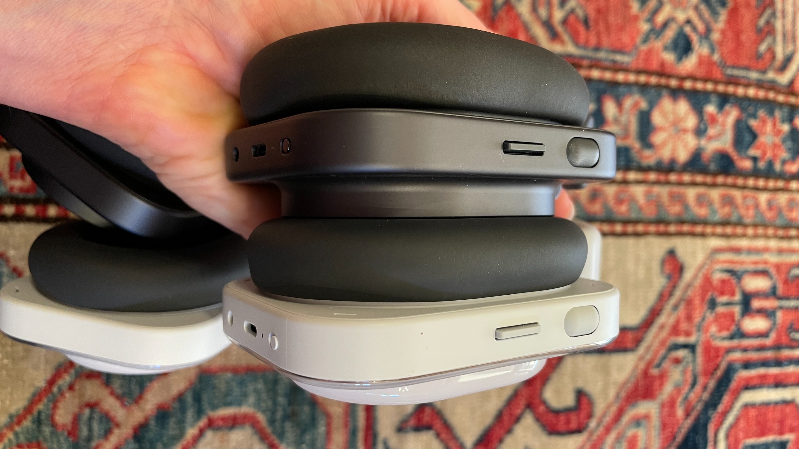 Nothing headphones arranged together, to show the different cases