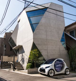 The Smart Vision EQ Fortwo outside Atelier Tekuto’s concrete house