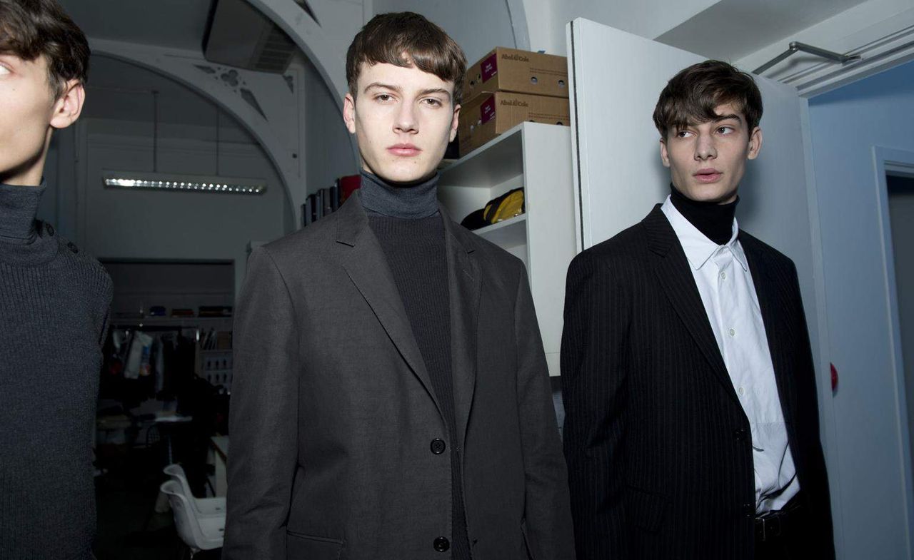 3 male models stood in a studio