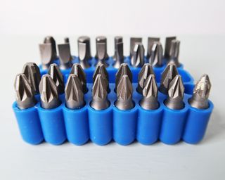 a selection of drill bits and screwdriver heads for putting up a shelf