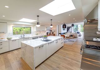 kitchen room with wooden flooring and white countertops