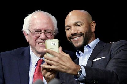 Bernie Sanders takes a selfie.