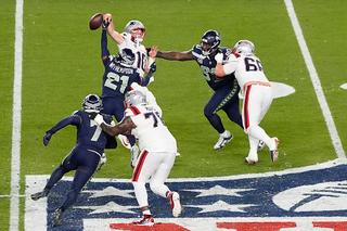 SANTA CLARA, CALIFORNIA - FEBRUARY 08: Devon Witherspoon #21 of the Seattle Seahawks forces a fumble against Drake Maye #10 of the New England Patriots during the fourth quarter in Super Bowl LX at Levi's Stadium on February 08, 2026 in Santa Clara, California. (Photo by Thearon W. Henderson/Getty Images)
