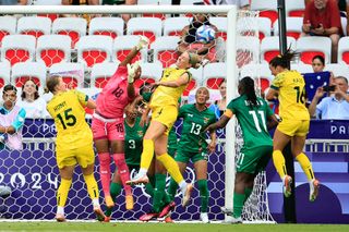 Australia's forward #16 Hayley Raso (R) scores a goal past Zambia's goalkeeper #18 Ngambo Musole in the women's group B football match between Australia and Zambia during the Paris 2024 Olympic Games at the Nice Stadium in Nice on July 28, 2024.