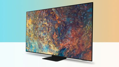 Samsung QN90A TV on white surface against blue and yellow background