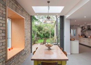 kitchen side extension with picture window and bifold doors and roof lantern