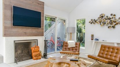 a white and brown themed organized living room