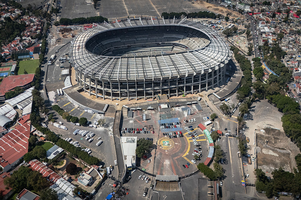 An aerial view of the Azteca Stadium in Mexico City taken on October 28, 2025. While millions celebrate Mexico hosting the FIFA World Cup for a third time, entire families of street vendors watch with concern as the football festivities threaten their long-standing source of income. (Photo by CARL DE SOUZA / AFP)