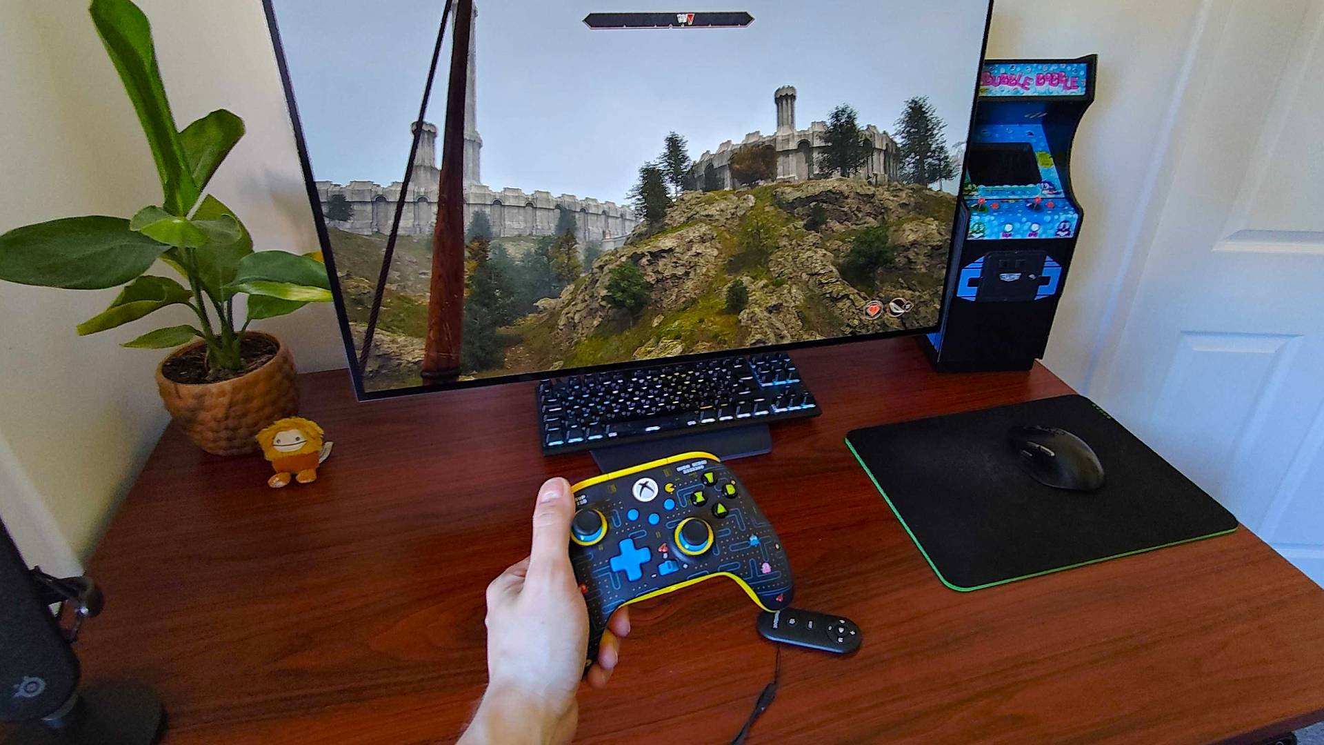 Phil Hayton holding Pac-Man PowerA controller while using Flexispot Treadmill to play Oblivion Remastered.