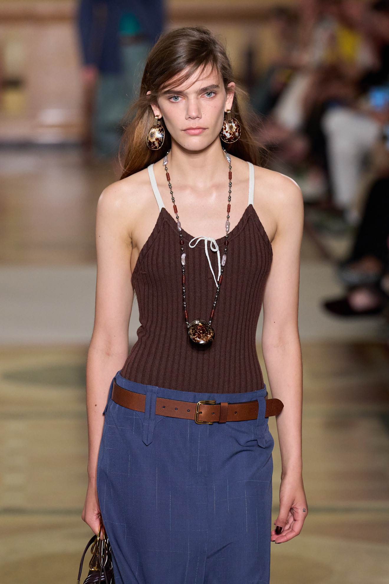 A model wearing a Tory Burch beaded necklace.