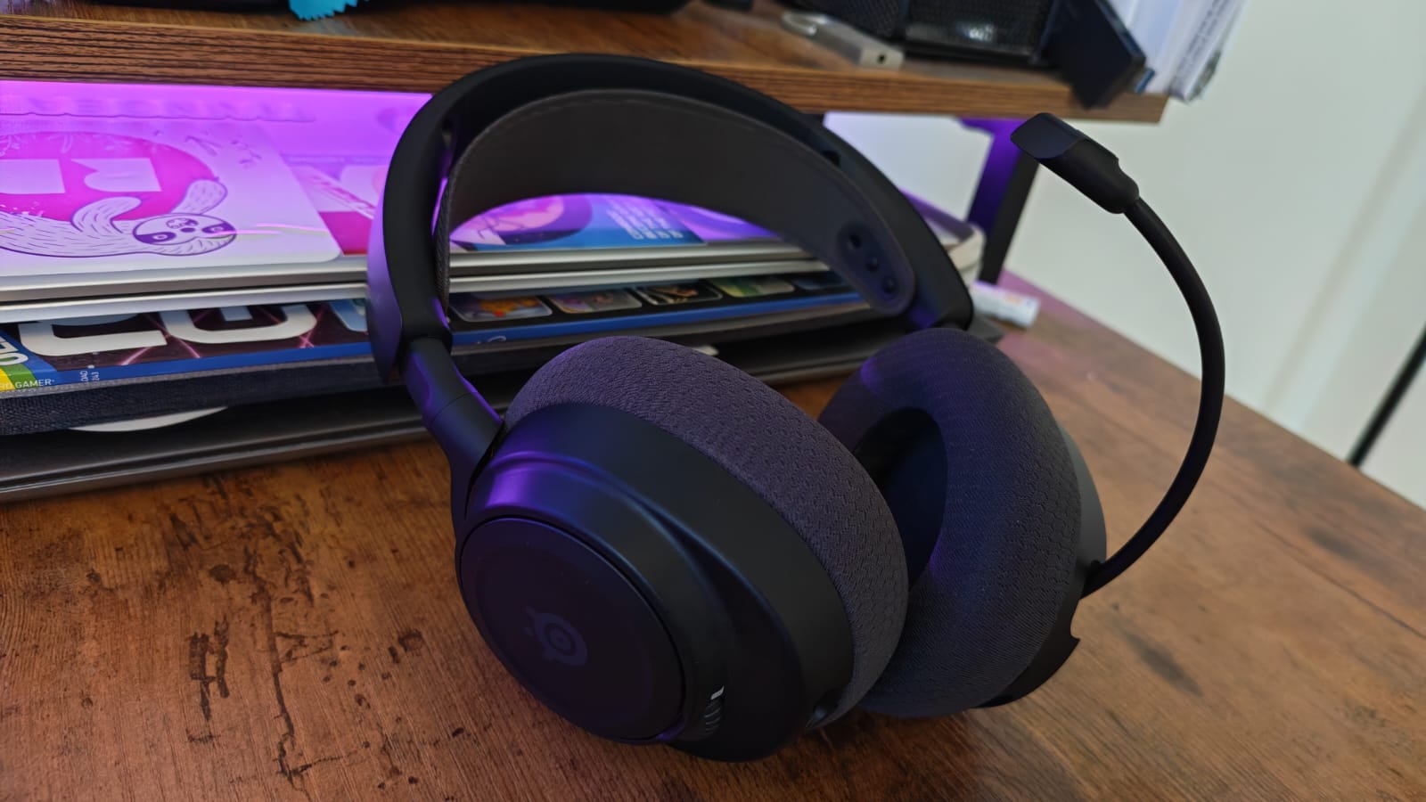 A black SteelSeries Arctis Nova 7 Gen 2 with its mic extended