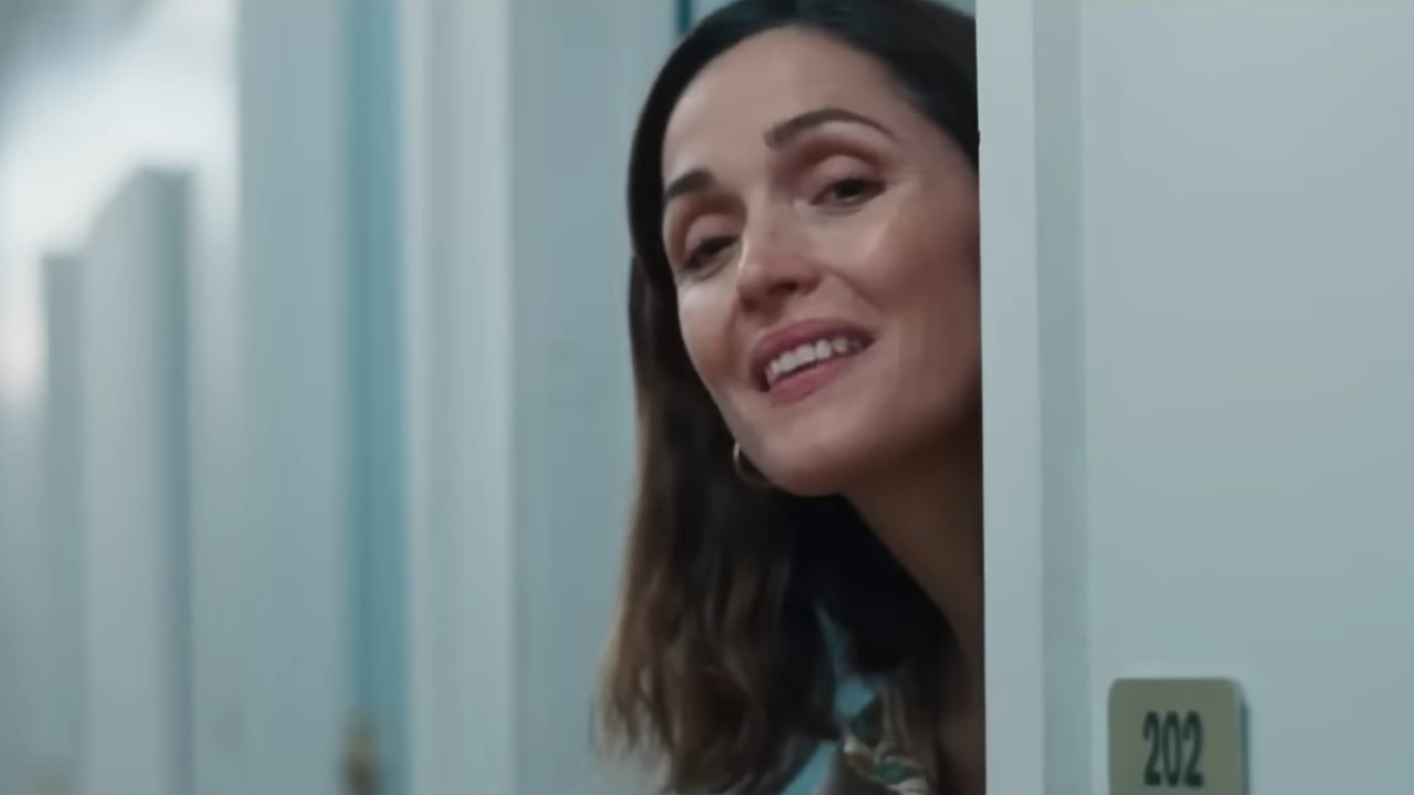 Rose Byrne smiling and looking out in If I Had Legs I'd Kick You.